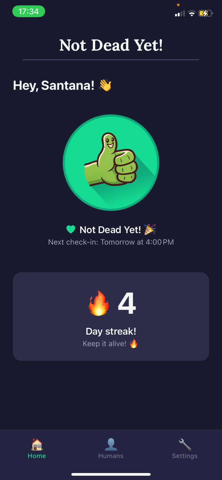 Not Dead Yet! main check-in screen with the big green thumbs-up button, streak counter, and check-in status